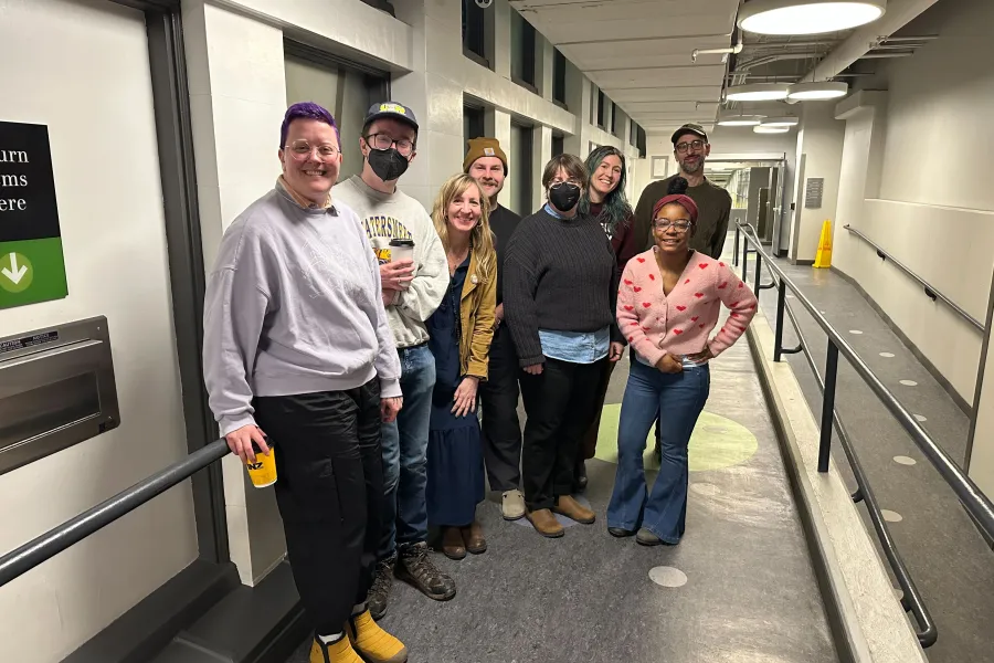 The bargaining committee in the hallway near the portal entry at Main