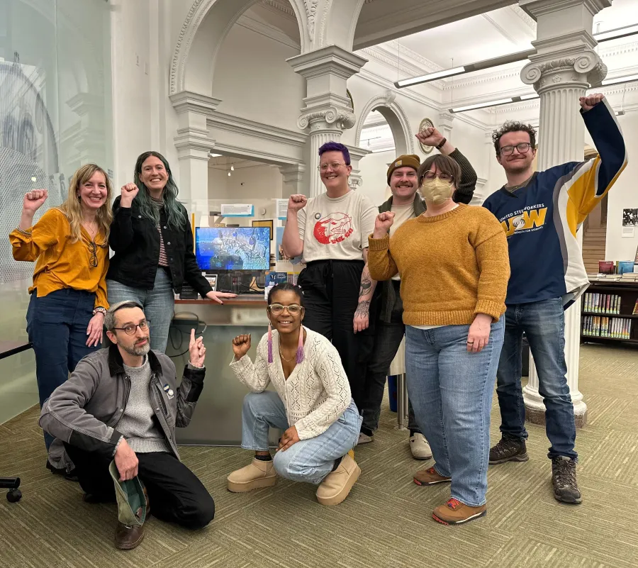 Bargaining Committee of USW 9562 in a group photo with the Penguin Tracker